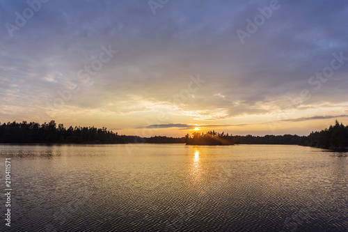 dramatic sunset on a forest lake