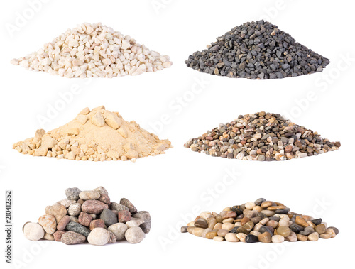 Piles of various gravel, stones and pebbels isolated on white background photo