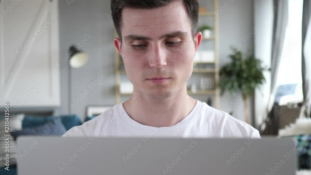 Close Up of Young Man Working On Laptop in Office Close Up of Young Man Working On Laptop in Office