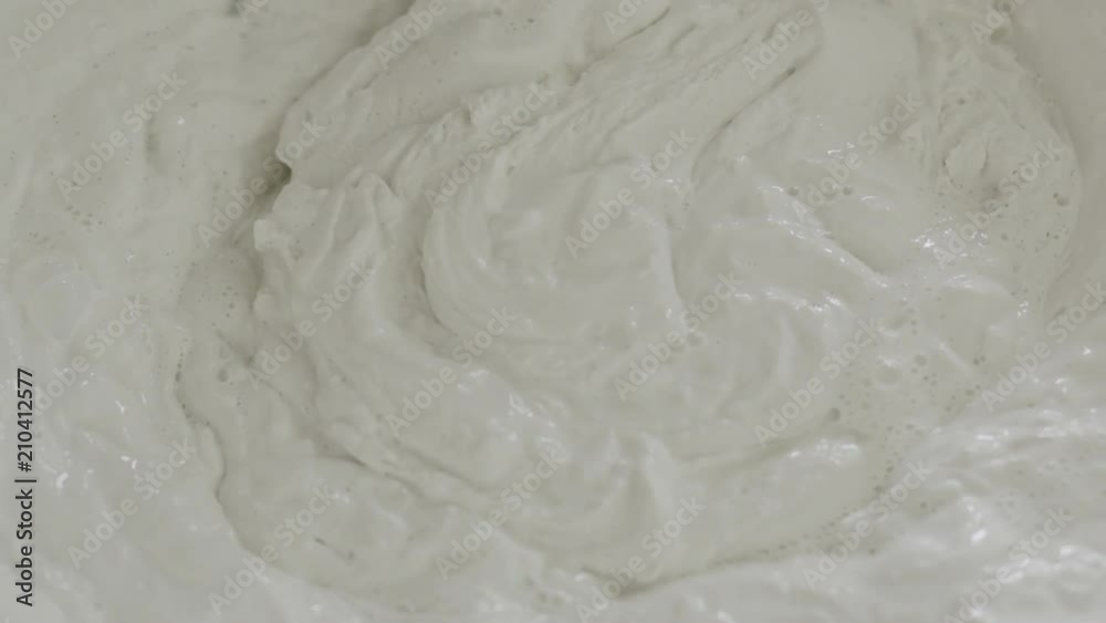 Slow motion closeup mixing decorative concrete plaster Slow motion closeup mixing decorative concrete plaster