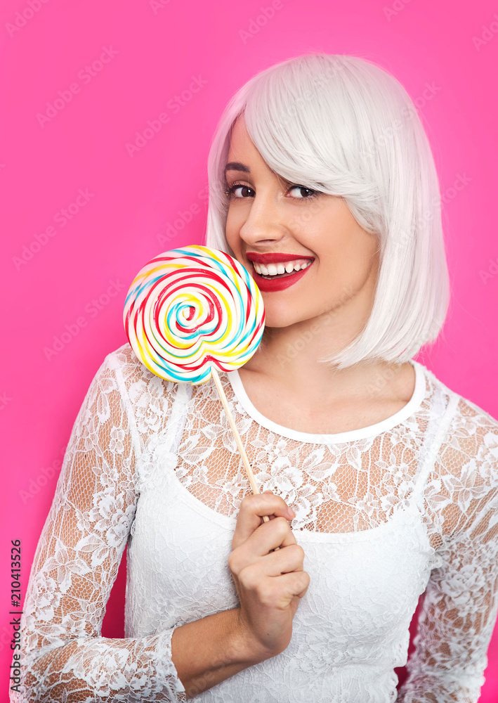 Young woman holding lollipop 