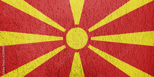 Texture of Macedonia flag on the wall of relief plaster.