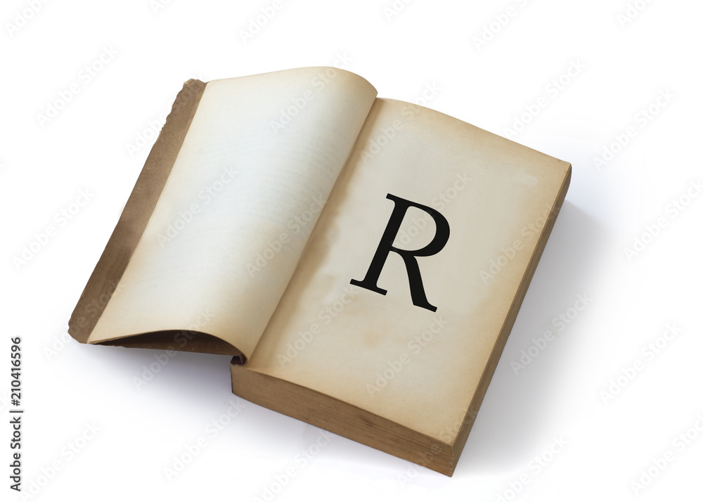 R letter on open old book R letter on open old book
