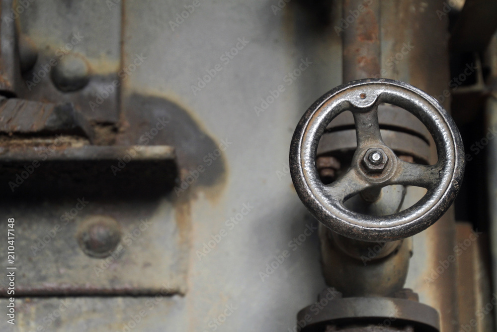 Valve handle in abandoned steel factory Valve handle in abandoned steel factory