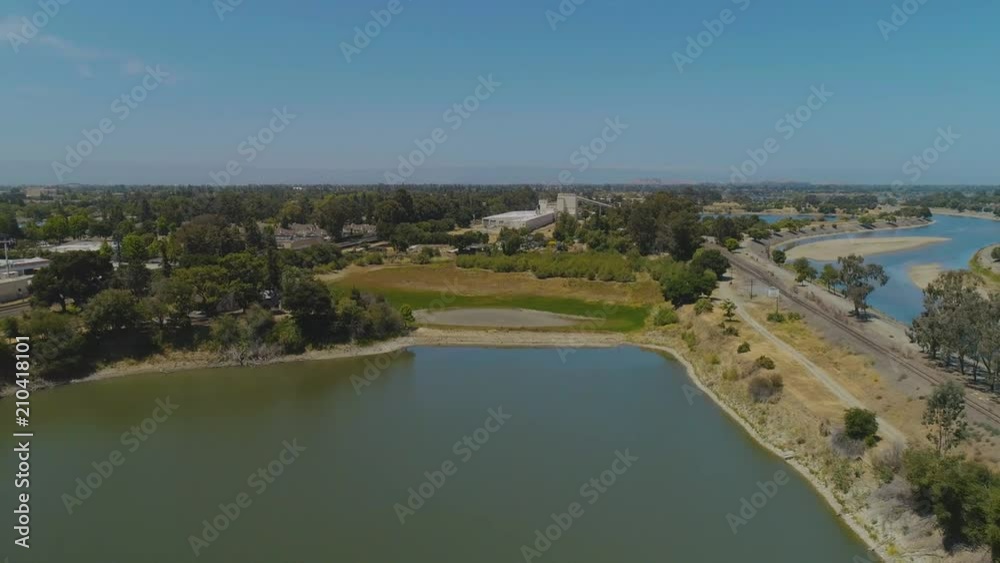 Aerial views over an old rail yard and the surrounding lakes and rivers. Aerial views over an old rail yard and the surrounding lakes and rivers.
