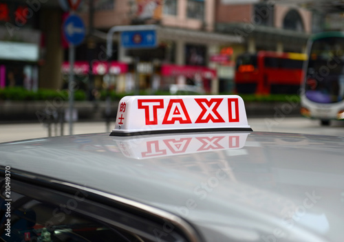 Taxi sign in Hong Kong in both English and Chinese
