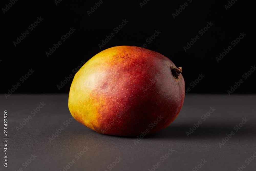 fresh raw of mango on black background fresh raw of mango on black background