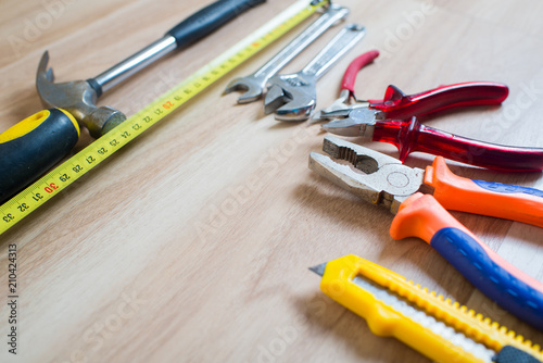 repairs or construction tools on wooden background