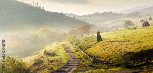 Obraz na plátne panorama of mountainous rural area on a hazy morning