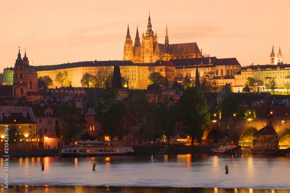 St. Vitus Cathedral in the night illumination against the background of the April sunset. Czech Republic, Prague