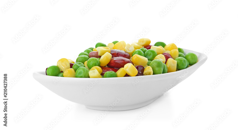 Plate with frozen vegetables on white background