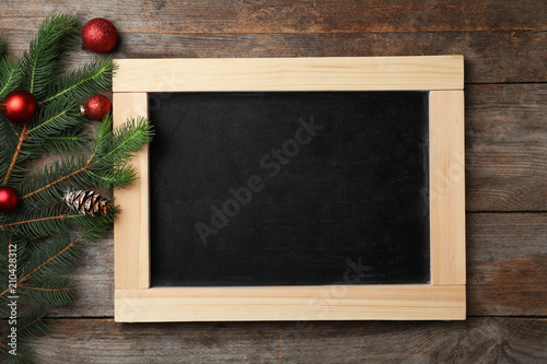 Chalkboard and decor on wooden background, top view. Christmas countdown