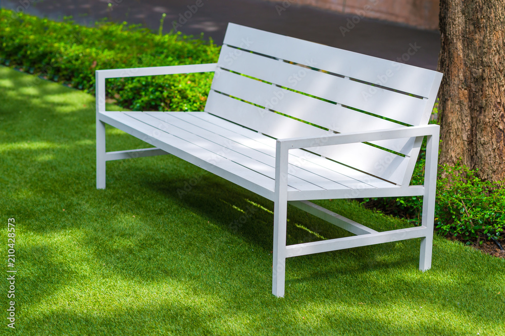 Modern white bench on green grass in the park for relaxation exterior contemporary Modern white bench on green grass in the park for relaxation exterior contemporary