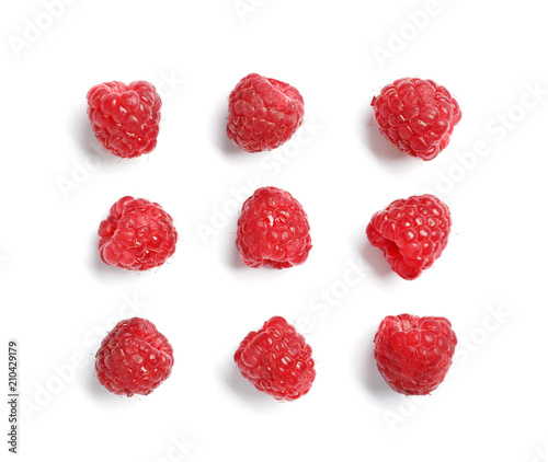 Delicious ripe raspberries on white background, top view