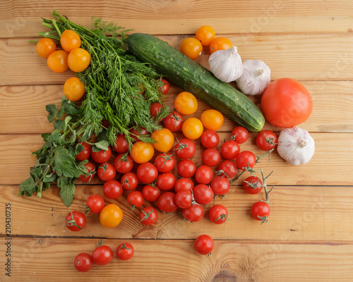 Vegetables on wooden background.