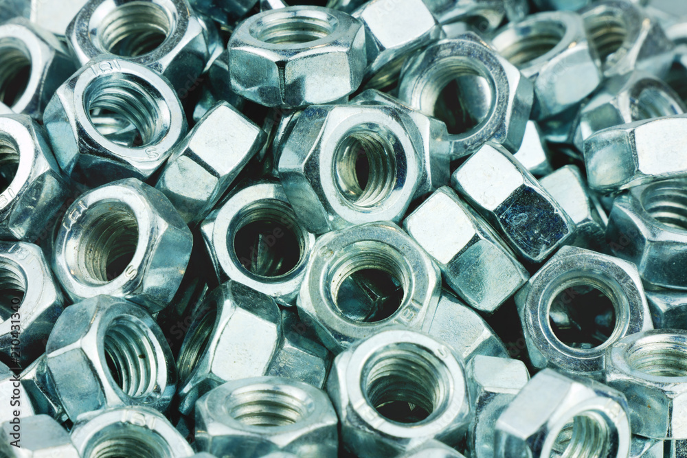 Shiny metal nuts for industrial background. Retro styled Shiny metal nuts for industrial background. Retro styled