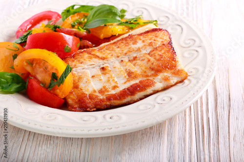 Fried white fish and tomato salad