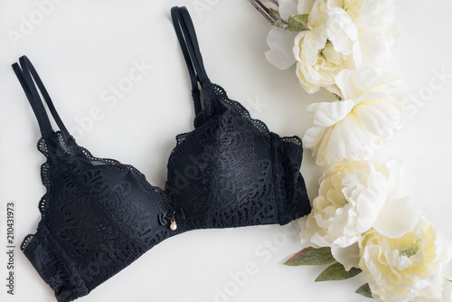 Classic black bra on the white background with peony
