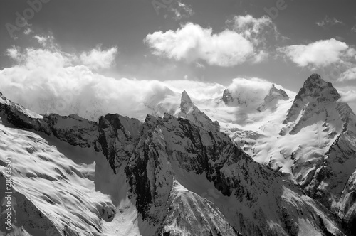 Black and white view on high mountains peak