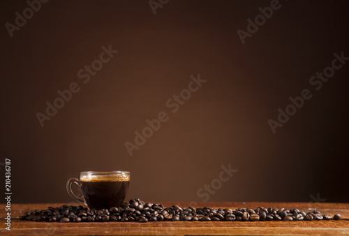 Coffee on a brown background with copy space