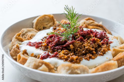 Turkish Manti with Yogurt, Minced Meat and Fried Butter Sauce From Artvin called Silor / Siron / Ziron Rolled Raw Dough and Fried Phyllo / Manlama photo