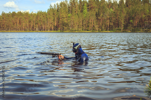 Underwater hunter  preparing to dive. © lizavetta