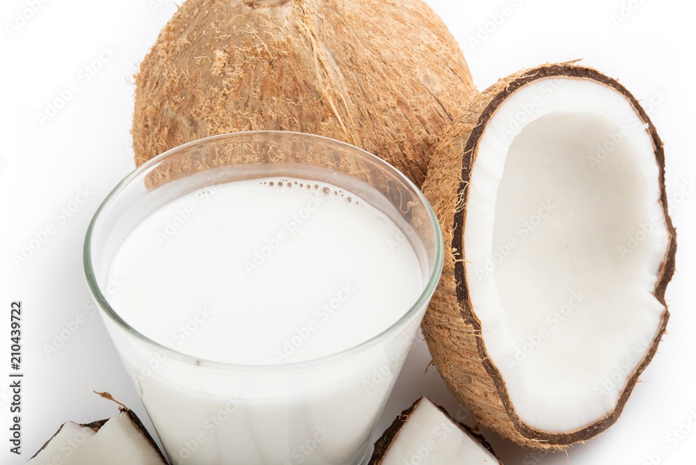 coconut oil and fresh coconuts isolated on white background coconut oil and fresh coconuts isolated on white background