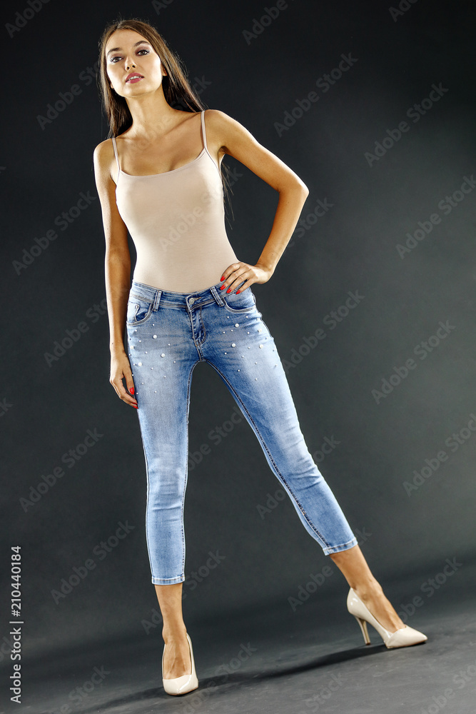 Slim young woman and jeans Slim young woman and jeans