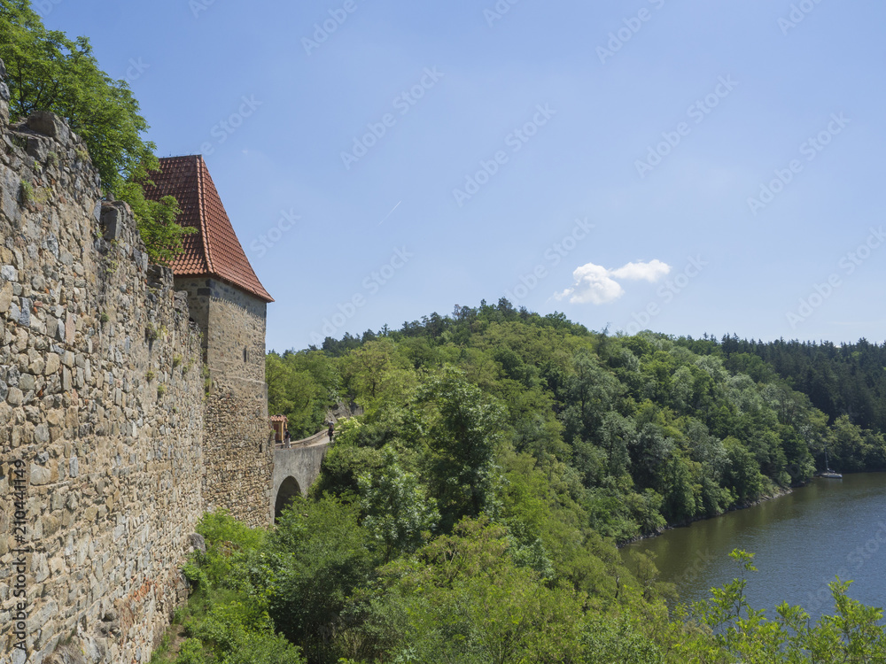 view from rampart of medieval castle Zvikov (Klingenberg), wall with tower, vltava river, spring green trees and blue sky, Czech Republic view from rampart of medieval castle Zvikov (Klingenberg), wall with tower, vltava river, spring green trees and blue sky, Czech Republic