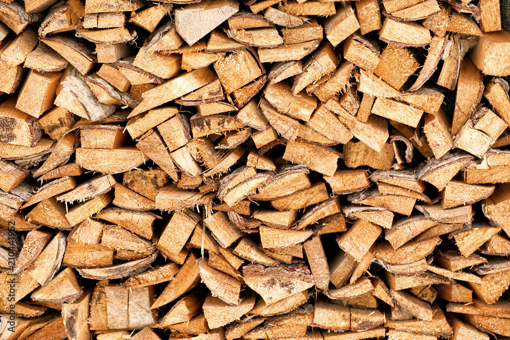 Firewood for heating the house in the winter period under the house. Firewood for heating the house in the winter period under the house.