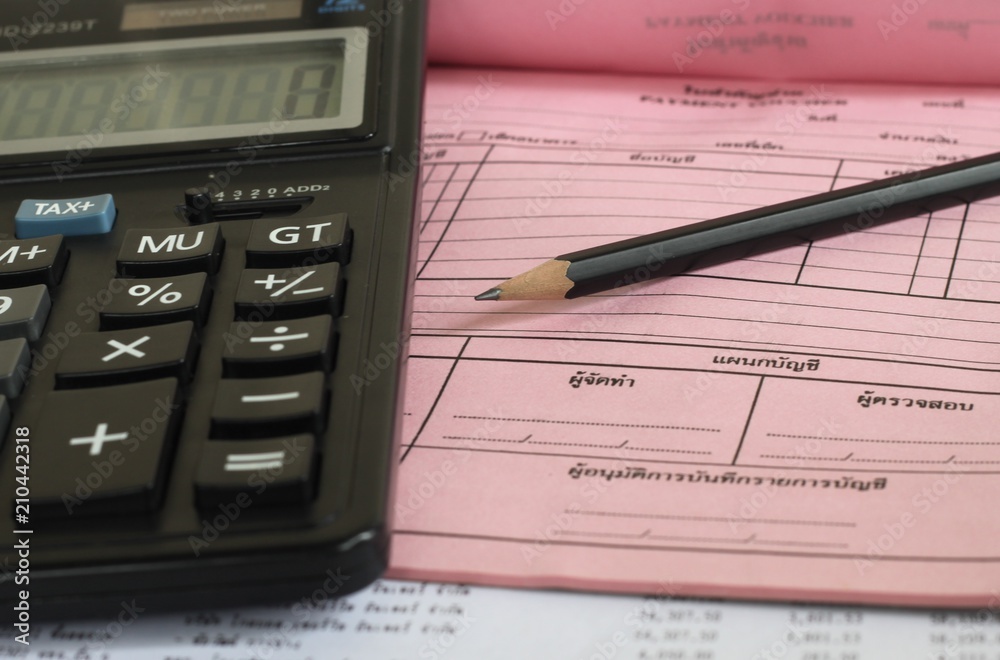 Financial accounting. Pencil and calculator on business report Financial accounting. Pencil and calculator on business report