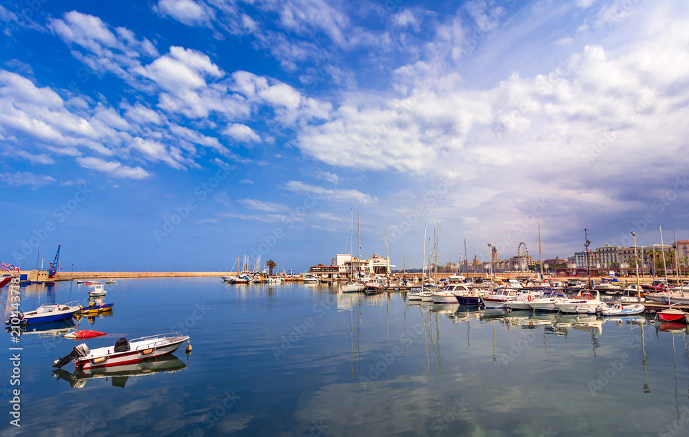 Bari, Italy, Puglia: Beautiful landscape with fishing boats, yaght and blue sea against the sky. Apulia