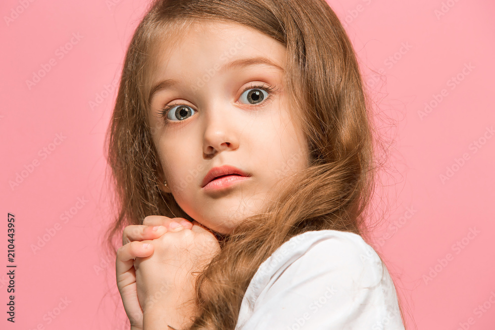Beautiful teen girl looking suprised isolated on pink Beautiful teen girl looking suprised isolated on pink