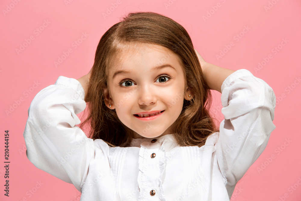 Beautiful teen girl looking suprised isolated on pink Beautiful teen girl looking suprised isolated on pink