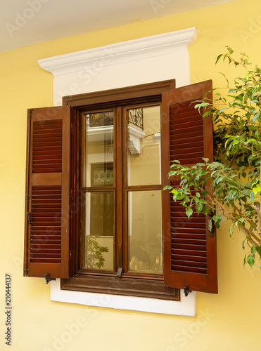 Wooden window with shutters in a Greek village  Crete