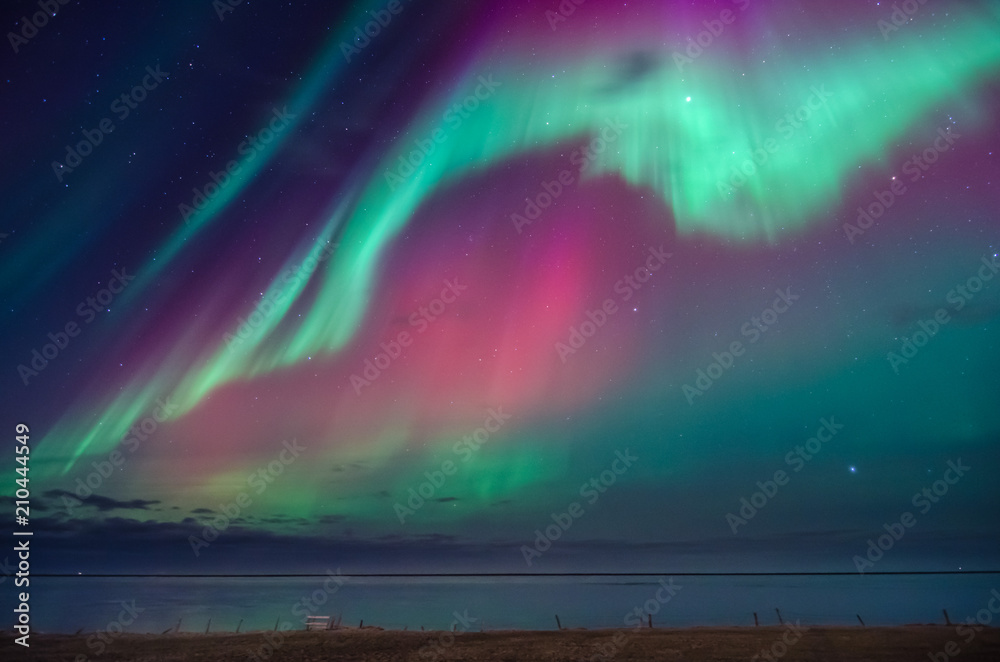 Colorful northern lights over iceland sky
