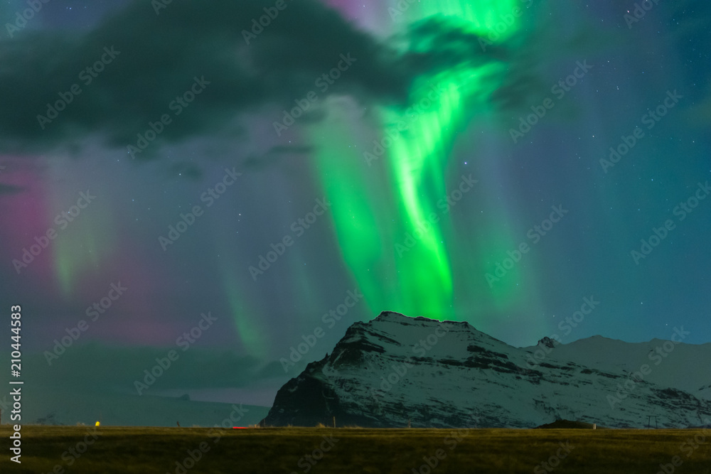 Colorful northern lights over iceland sky