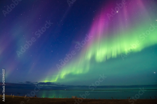 Fotografie Colorful northern lights over iceland sky