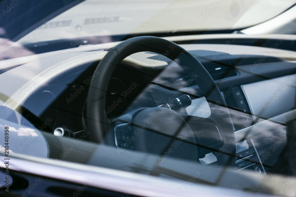 close up view of steering wheel on black car