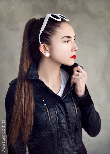 Young pierced woman wearing sunglasses photo