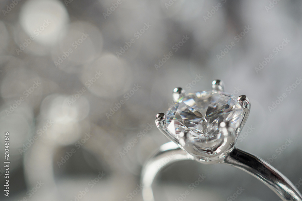 luxury engagement Diamond ring with abstract bokeh light background