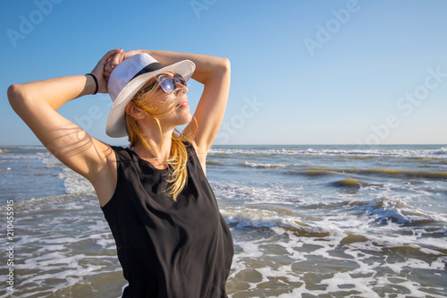 portrait of beautiful woman to the sea