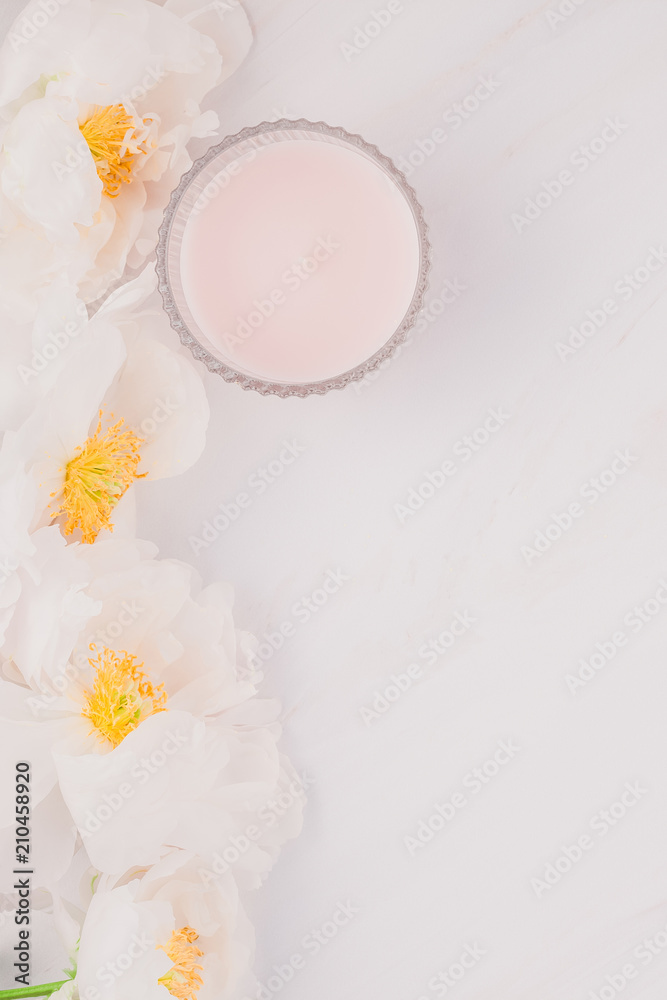 White peony flowers on marble background