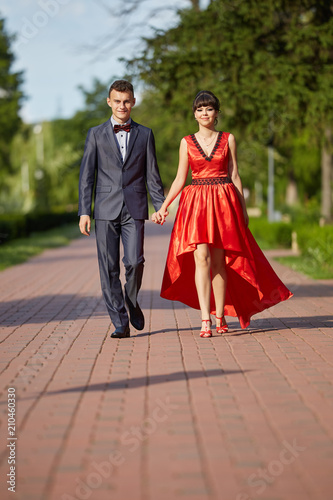 Elegant couple walking in the park