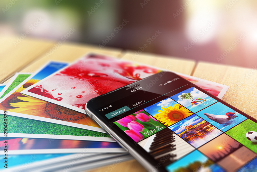 Stack of photos and smartphone with image gallery app - obrazy, fototapety, plakaty 