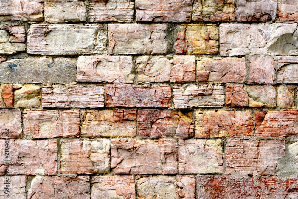 Fototapeta premium Old weathered brick wall as background or texture