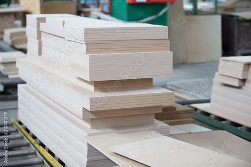 Fotografija Piles of plywood. Wood processing shop