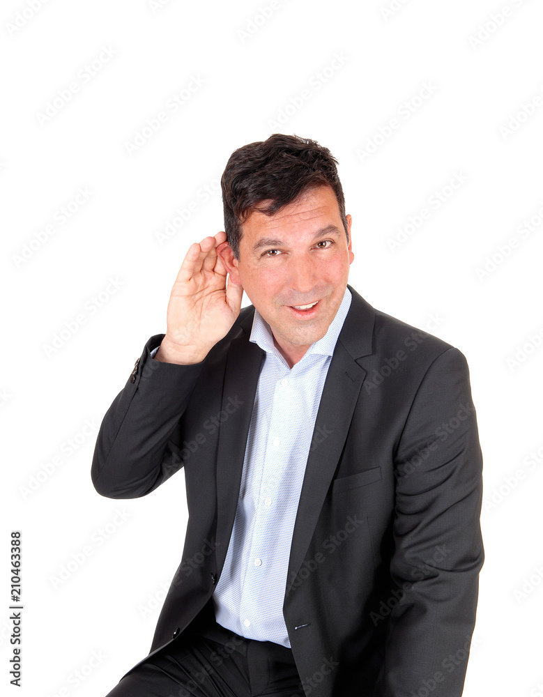 Man sitting with hand on ear can not hear Man sitting with hand on ear can not hear
