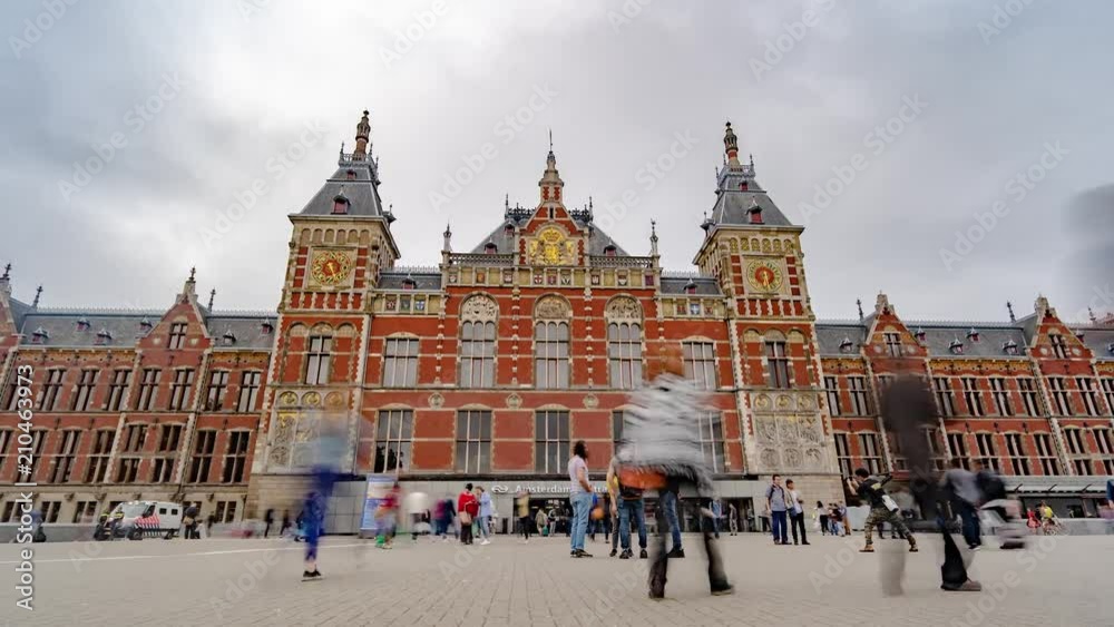 Hyperlapse in Amsterdam City Center with Central Train Station and Moving Clouds.
