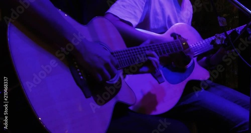 Musician in the restaurant. Bangkok, Thailand. musician play and sing the music for customer to come have dinner in the restaurant at night.